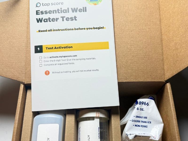Unopened Tap Score Essential Well Water Test kit with sample containers and instructions
