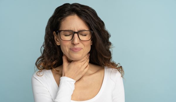 a picture of a women get nausea after drinking water