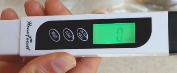 A picture of a handheld TDS meter with LED display