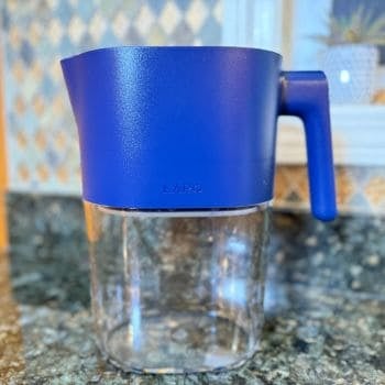 LARQ PureVis water filter pitcher in blue, shown on a kitchen counter