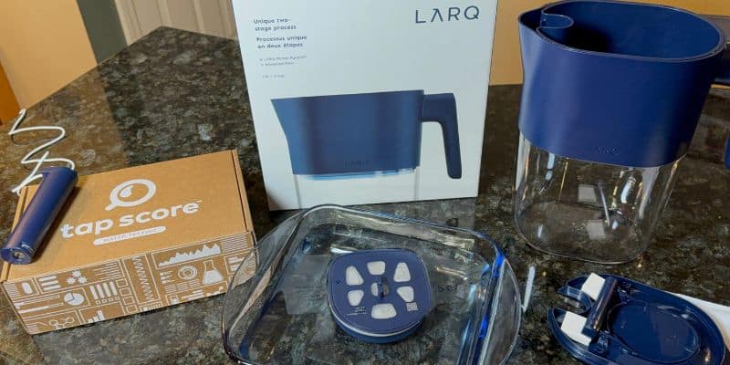 Charging the battery and activating the filter of the LARQ PureVis water pitcher with all parts and Tap Score testing kit shown