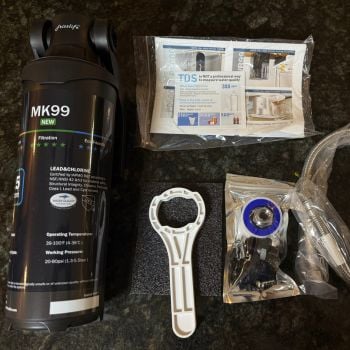 Frizzlife MK99 under sink water filter unboxing with wrench, hoses, and fittings
