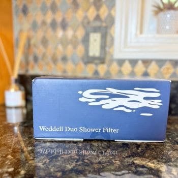 Weddell Duo Shower Filter retail box on kitchen counter