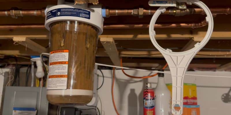 Whirlpool WHKF-DWHBB housing with a sediment-loaded filter cartridge