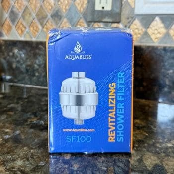 AquaBliss SF100 revitalizing shower filter retail box on kitchen counter