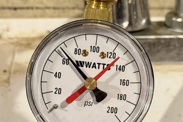 Water pressure gauge showing a stable 65 PSI after three years of continuous use with the SpringWell CF1 filter.