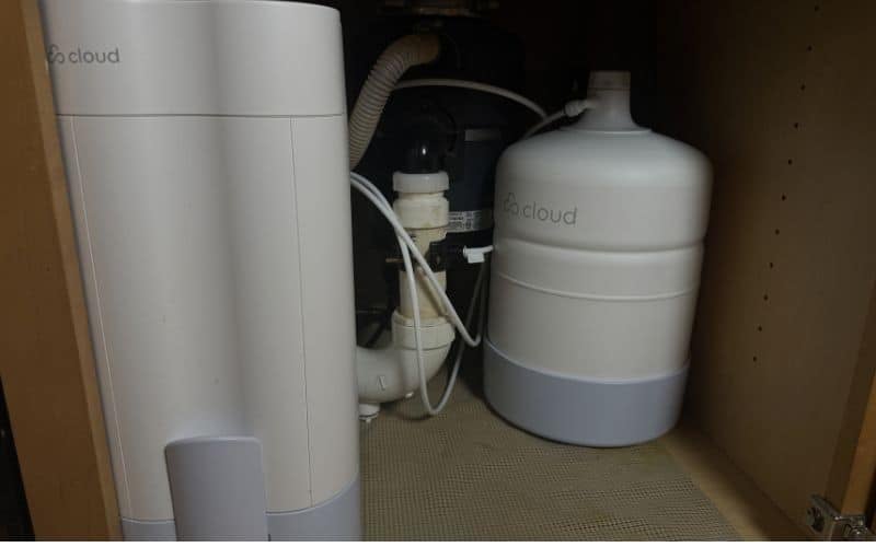 Cloud RO filter module on the left and storage tank on the right under our kitchen sink